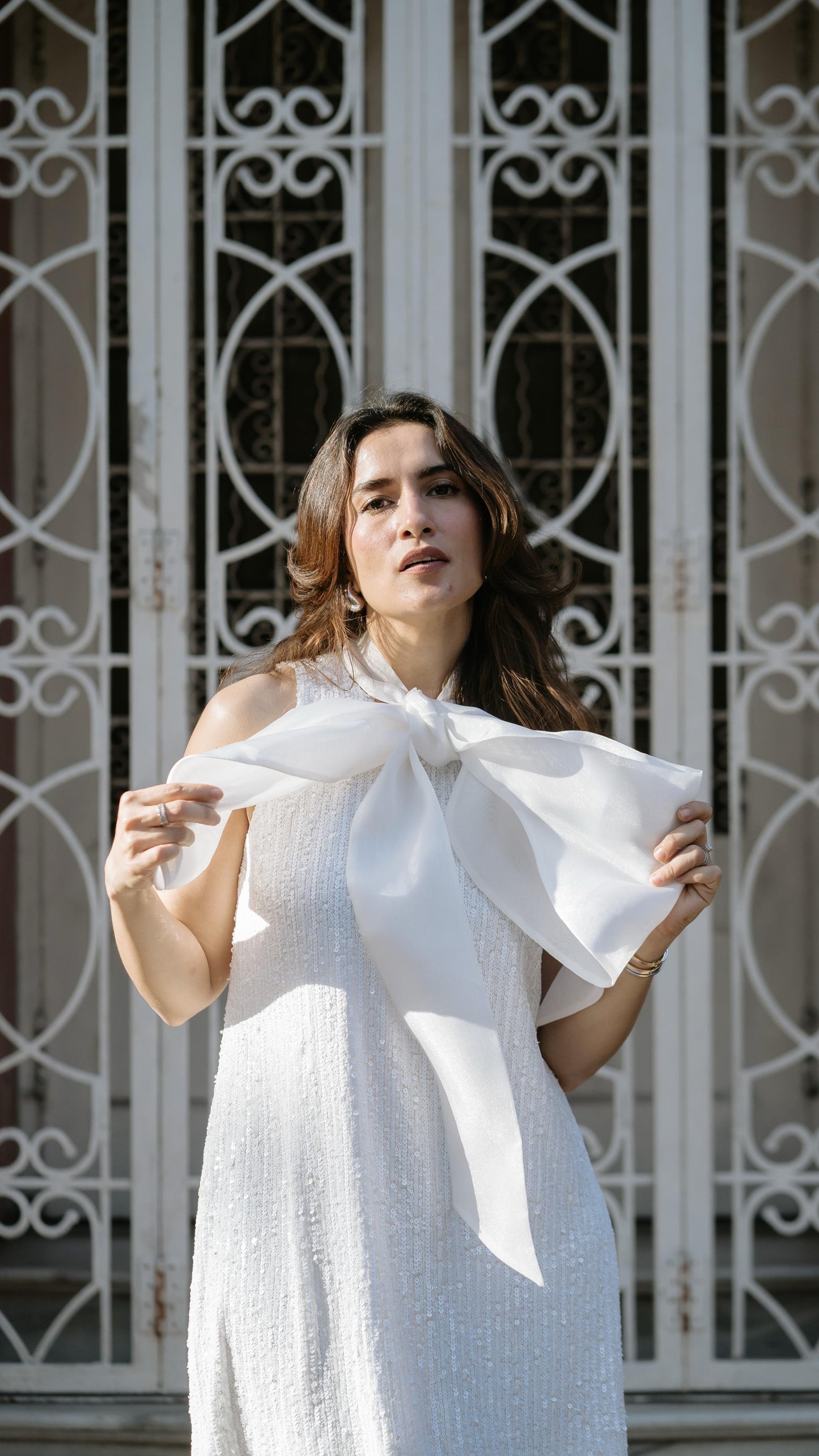 Urmi in White Sequin Bow Dress